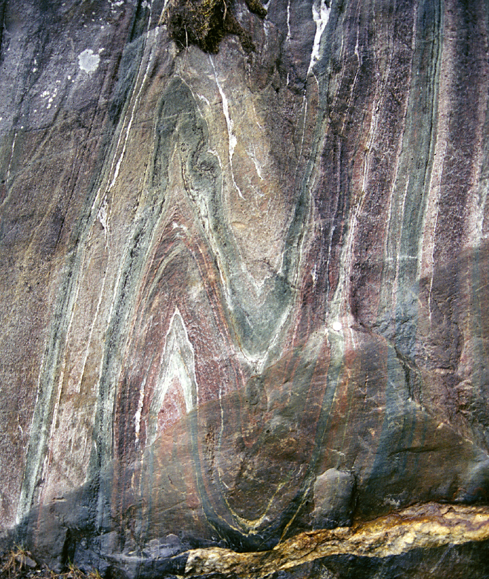 Anticline (left) and syncline (right) in isoclinal fold in metamorphic rock.