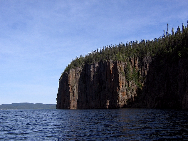 A cliff exposing a thick unit of shock melt at Manicouagan.