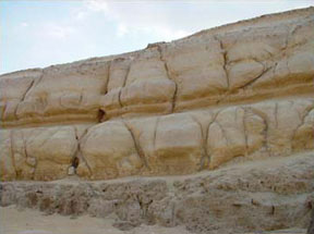 picture of deep fissures and evidence of water erosion on enclosing walls of the great sphinx